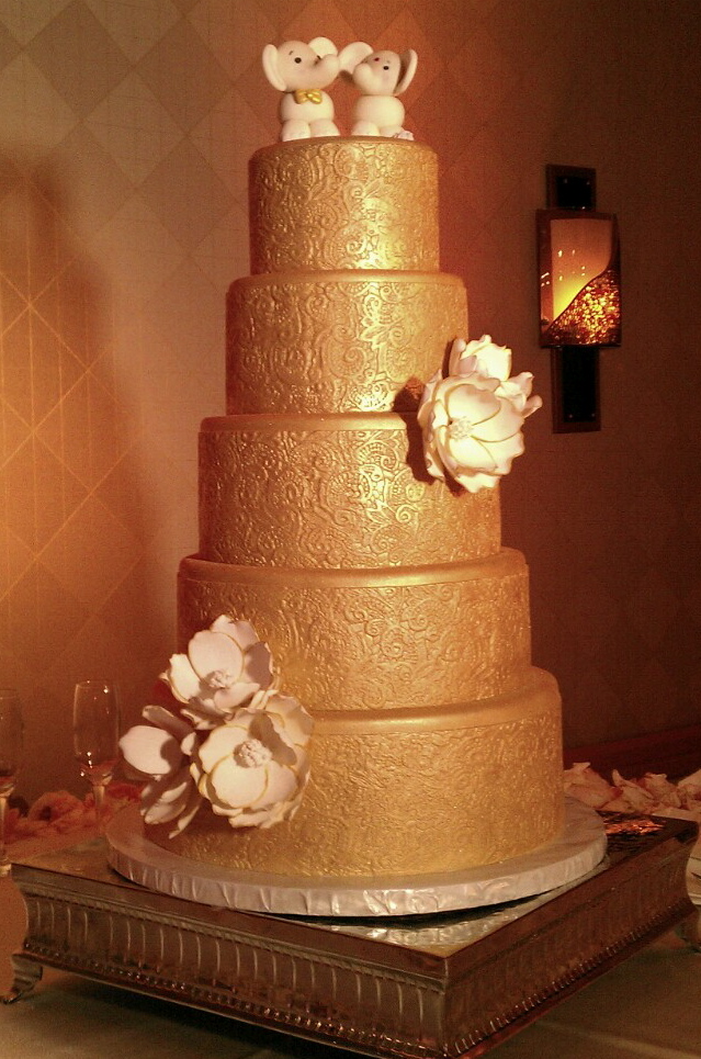 indian gold cake with floral engravings