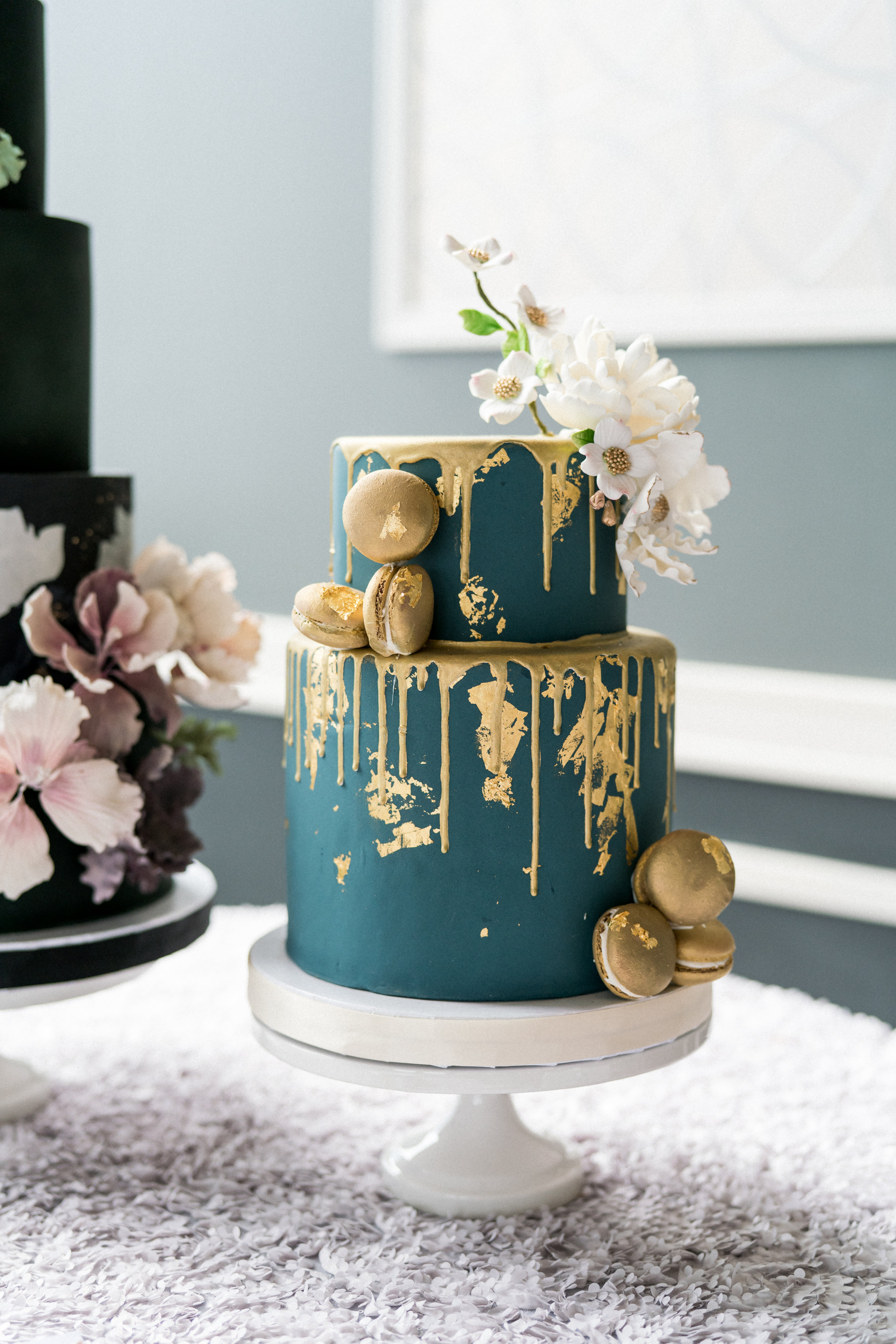 blue and gold drip macaroon cake